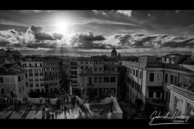 Black and white panoramic view over Rome with strong sunset light