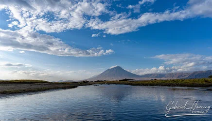 Ol Doinyo Lengai volcano seen from Lake Natron, Tanzania, photographed during a guided photographic safari.