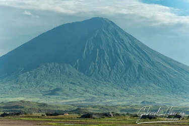 Ol Doinyo Lengai volcano seen from Lake Natron, Tanzania, photographed during a guided photographic safari.