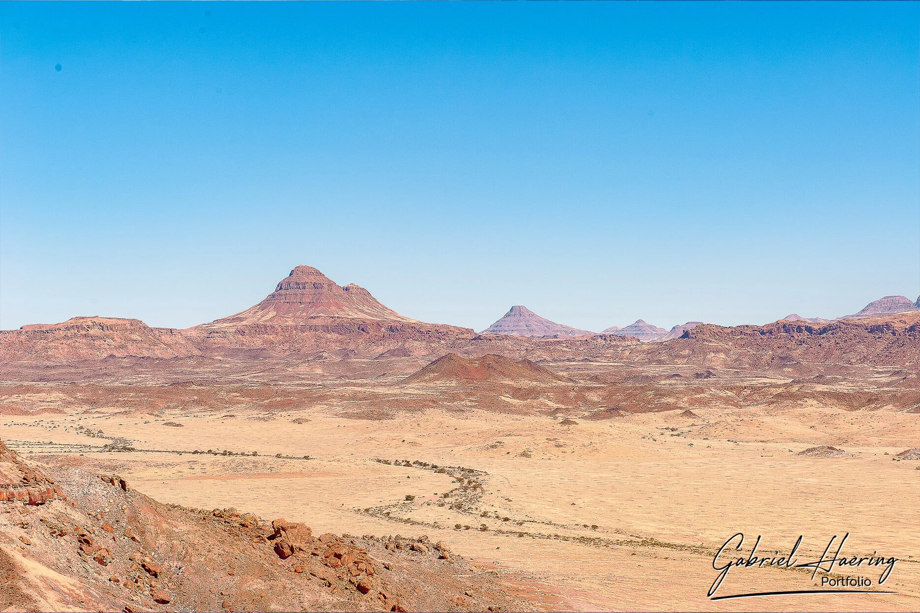 Rocky desert mountains and dry riverbed landscape in Damaraland Namibia